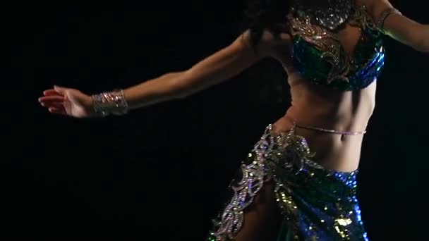 Traditional oriental belly dancer girl dancing. Black background. Slow motion. Close up — Stock Video