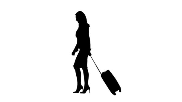 Girl walk a suitcase in hand . Side view. White background. Silhouette — Stock Video