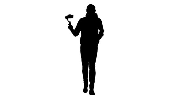 Mans silhouette producing video while running using steadicam and smartphone. — Stock Video