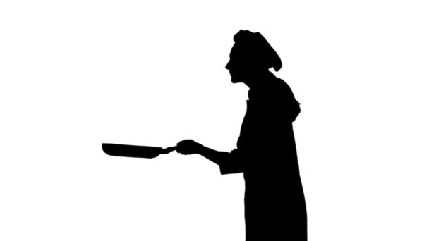 La silhouette nera dello chef frigge e annusa un piatto . — Video Stock
