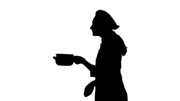 Μαύρη σιλουέτα ενός σεφ θηλυκό σε ομοιόμορφη μυρωδιά πιάτο. — Αρχείο Βίντεο