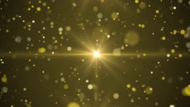 Golden beams of light with particles go from center — Stock Video