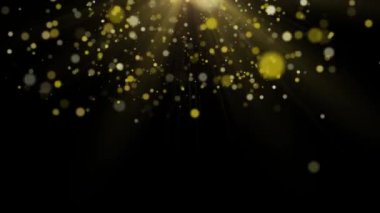 Siyah arka plan üzerinde altın tozu bokeh