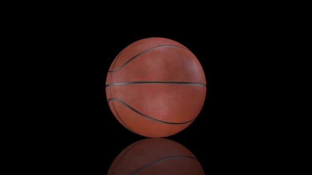 Animacja 3D, piłka do koszykówki obracająca się w miejscu na powierzchni lustra. — Wideo stockowe
