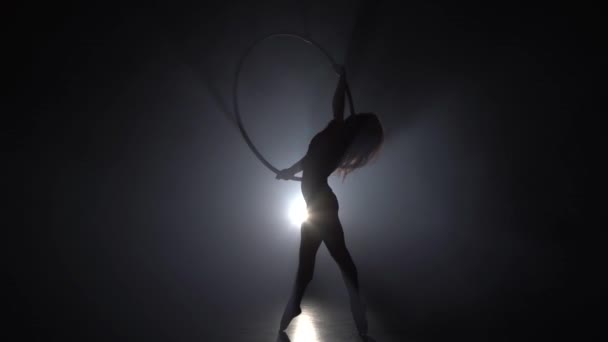 Aerial acrobat in the ring. A young girl performs the acrobatic elements in the air ring 037 — Stock Video