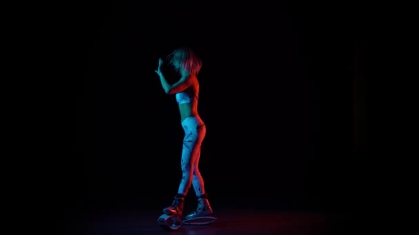 Woman dancing in kangoo jumps shoes at studio — Stock Video