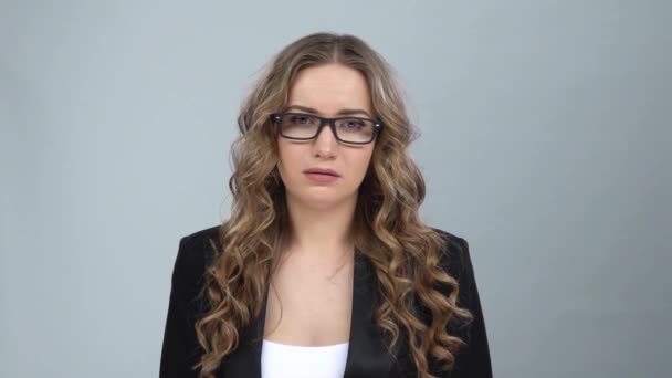 Woman in business suit is upset and tired, takes off her glasses, slow motion — Stock Video