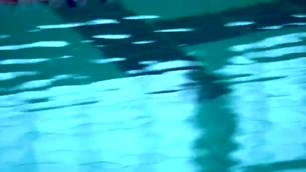 Close up of waves over deep water in swimming pool. — Stock Video