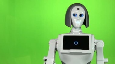Robot bir el hareketi kendini çağırıyor ve konuşuyor. Yeşil ekran. Yavaş çekim