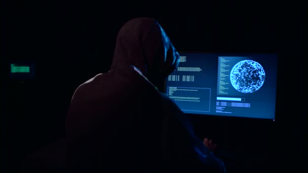 Hacker enters the virus data into the computer — Stock Video