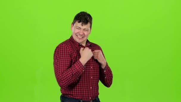 Young guy is happy with his victories, he is happy. Green screen. Slow motion — Stock Video