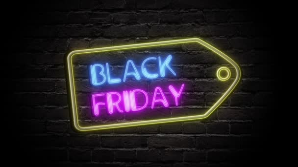 Black Friday animation neon light sign, price tag banner on brick wall. Sale banner blinking neon sign style for promo video. Concept of sale and clearance. — Stock Video
