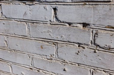 Beton çözeltisine bağlanmış beyaz-gri tuğla bir taştan oluşan gözenekli bir doku. Bulanık odak