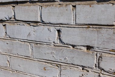 Beton çözeltisine bağlanmış beyaz-gri tuğla bir taştan oluşan gözenekli bir doku. Bulanık odak