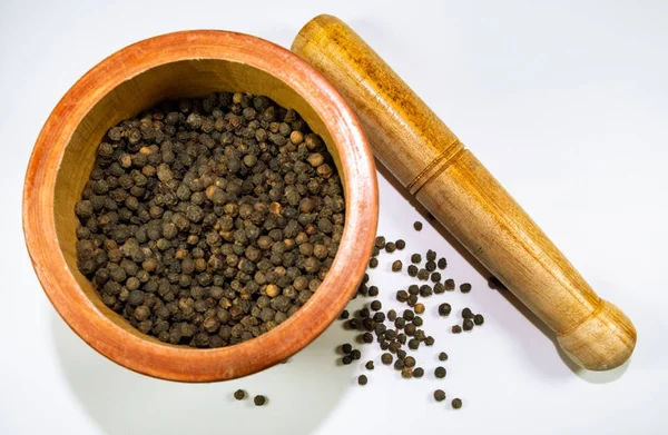 black pepper in a mortar for grinding
