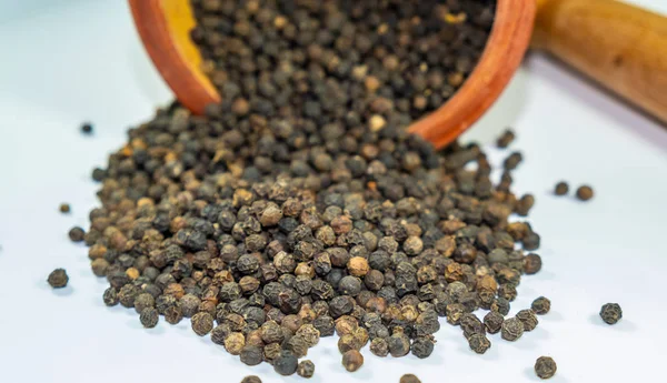 black pepper in a mortar for grinding