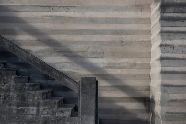 Concrete staircase in the streets of Penedo, in Alagoas State, Brazil - abstraction, lines, shadows and sunlight (composition with lines for a text and words)