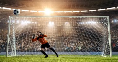 Kaleci profesyonel futbol stadyumu bir atlama bir hedefi kaydetmek çalışıyor. Stadyum ve kalabalık 3d yapılır.