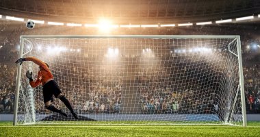 Kaleci profesyonel futbol stadyumu bir atlama bir hedefi kaydetmek çalışıyor. Stadyum ve kalabalık 3d yapılır.