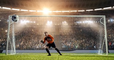 Kaleci profesyonel futbol stadyumu bir atlama bir hedefi kaydetmek çalışıyor. Stadyum ve kalabalık 3d yapılır.