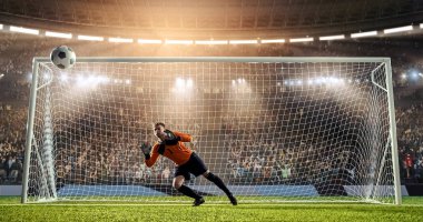 Kaleci profesyonel futbol stadyumu bir atlama bir hedefi kaydetmek çalışıyor. Stadyum ve kalabalık 3d yapılır.