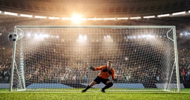 Kaleci profesyonel futbol stadyumu bir atlama bir hedefi kaydetmek çalışıyor. Stadyum ve kalabalık 3d yapılır.