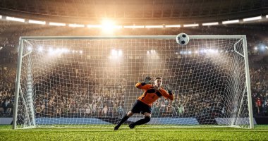 Kaleci profesyonel futbol stadyumu bir atlama bir hedefi kaydetmek çalışıyor. Stadyum ve kalabalık 3d yapılır.