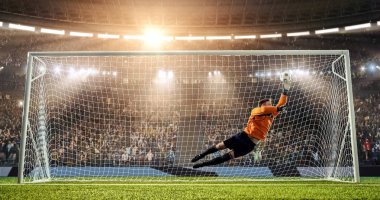 Kaleci profesyonel futbol stadyumu bir atlama bir hedefi kaydetmek çalışıyor. Stadyum ve kalabalık 3d yapılır.