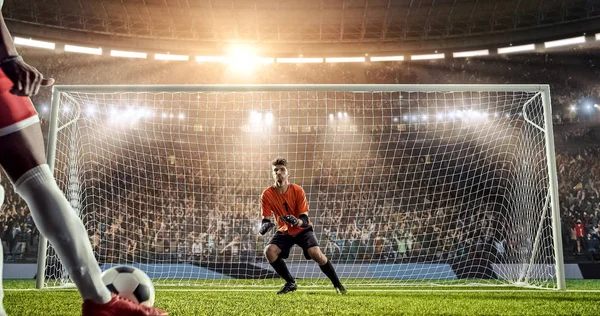 Soccer player is trying to score a goal while goalkeeper defends on a professional soccer stadium. Stadium and crowd are made in 3D.