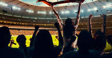 Grup hayranları tezahürat tarihinde stadyum spor şampiyonluk dikkat et. Onların takım kazandı ve herkes bu olayı kutluyoruz. İnsanlar rahat bir beze giyindin.
