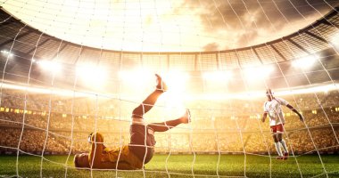 Yoğun futbol an güneş parlar süre profesyonel futbol stadyumu kalede önünde. Stadyum ve kalabalık 3d yapılır.