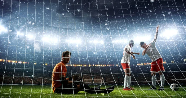 Intense soccer moment in front of the goal on the professional soccer stadium while it's snowing. Stadium and crowd are made in 3D.