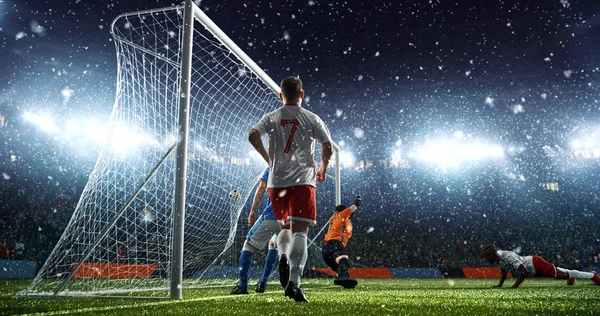 Intense soccer moment in front of the goal on the professional soccer stadium while it\'s snowing. Stadium and crowd are made in 3D.