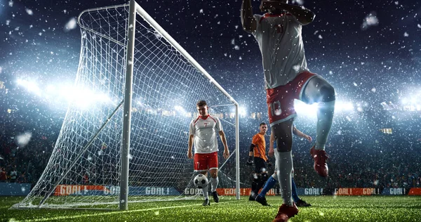 Intense soccer moment in front of the goal on the professional soccer stadium while it\'s snowing. Stadium and crowd are made in 3D.