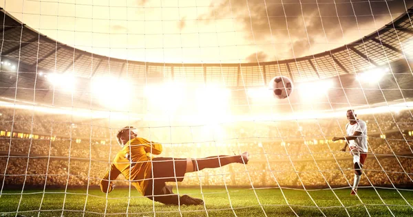 Intense soccer moment in front of the goal on the professional soccer stadium while the sun shines. Stadium and crowd are made in 3D.