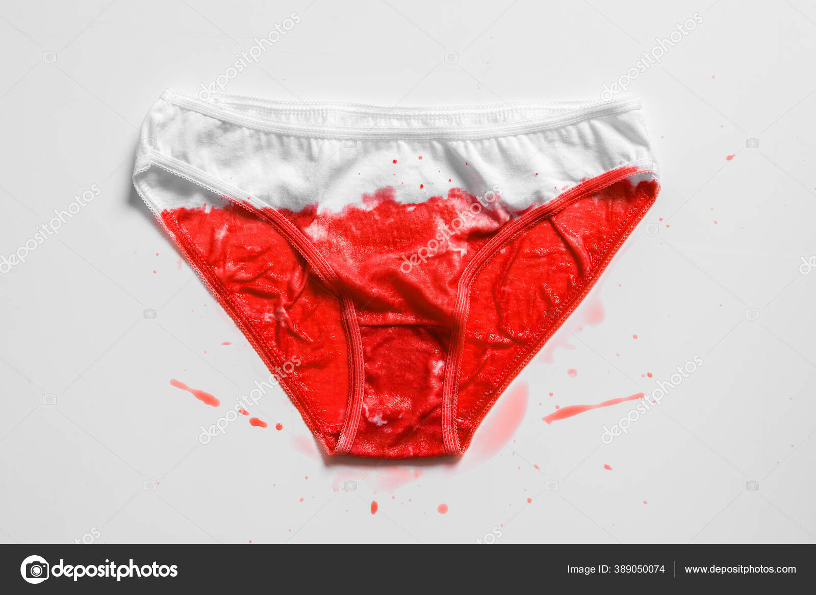 Menstrual fluid and womens underwear on white background, concept photo for  womens or feminist blog, ad womens apps Stock Photo by ©georgeeb22 389050074