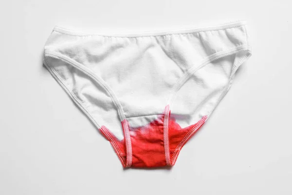 Menstrual fluid and womens underwear on white background, concept photo for womens or feminist blog, ad womens apps — Stock Photo, Image