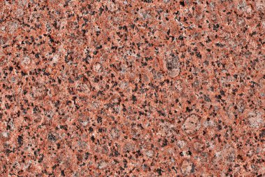 Granit arka plan. Doğal taş dokusu. Kırmızı yüzey. Desen.