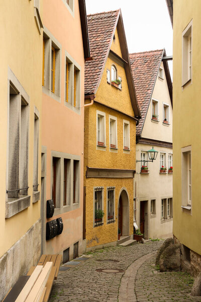 Street with colorful houses in Rothenburg, Germany.