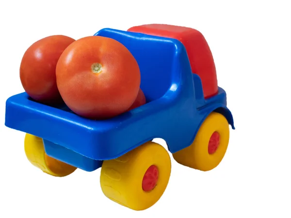 Bunte Lebendige Spielzeugauto Lkw Mit Roten Tomaten Nahaufnahme Von Hinten — Stockfoto