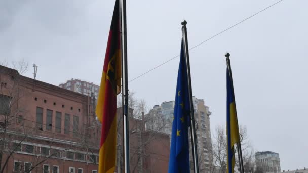 Three flags waving on poles - EU, DE and UA — Stock Video