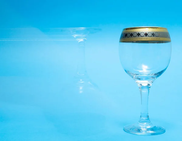 One Empty One Ghost Wine Glasses Blue Background — Stock Photo, Image