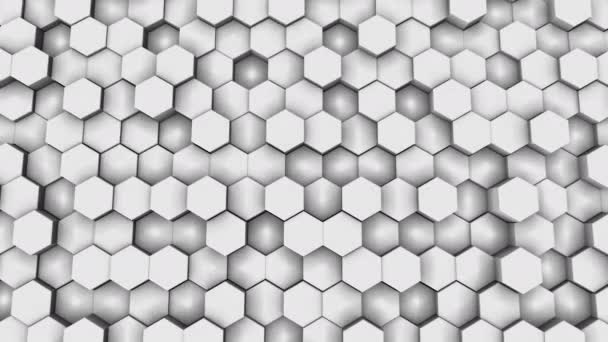 ハニカムグリッドの垂直壁 幾何学的パターンの各六角形の部分はランダムに上下に移動します ビジネスやスクリーンセーバーのためのループ4K 3Dレンダリング黒白の抽象的な背景 — ストック動画