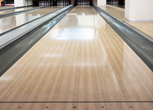 Close-up of one empty bowling track lane at entertainment center Stock Image