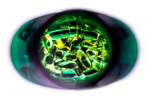 Yellow Pill Capsules Spilled Out Green Plastic Bottle Fish Oil — Stock Photo, Image