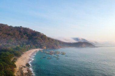 Beautiful view in the afternoon at Papuma beach, Jember, Indonesia. clipart