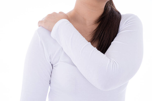 A woman feeling exhausted and suffering from shoulder and neck pain and injury on isolated white background. Health care and medical concept.