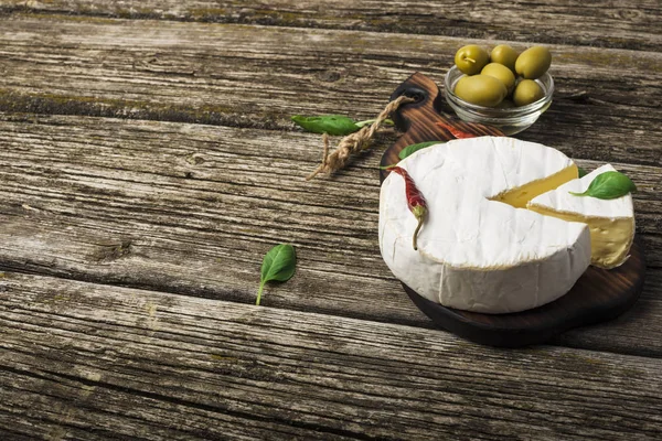 French Cheese Camembert Basil Leaves Peppers Olives Wooden Background Top — Stock Photo, Image