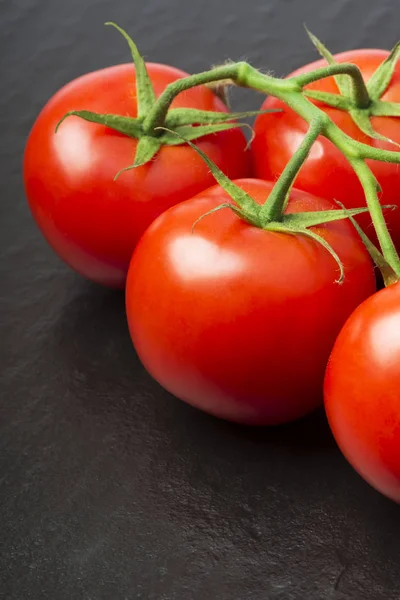 Branch Ripe Red Organic Tomatoes Green Leaves Black Background Selective — Stock Photo, Image