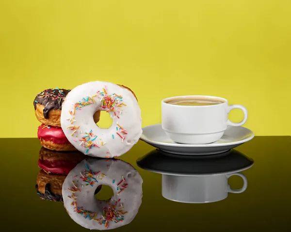 Three Delicious Donuts White Coffee Cup Coffee Yellow Background Reflection — Stock Photo, Image
